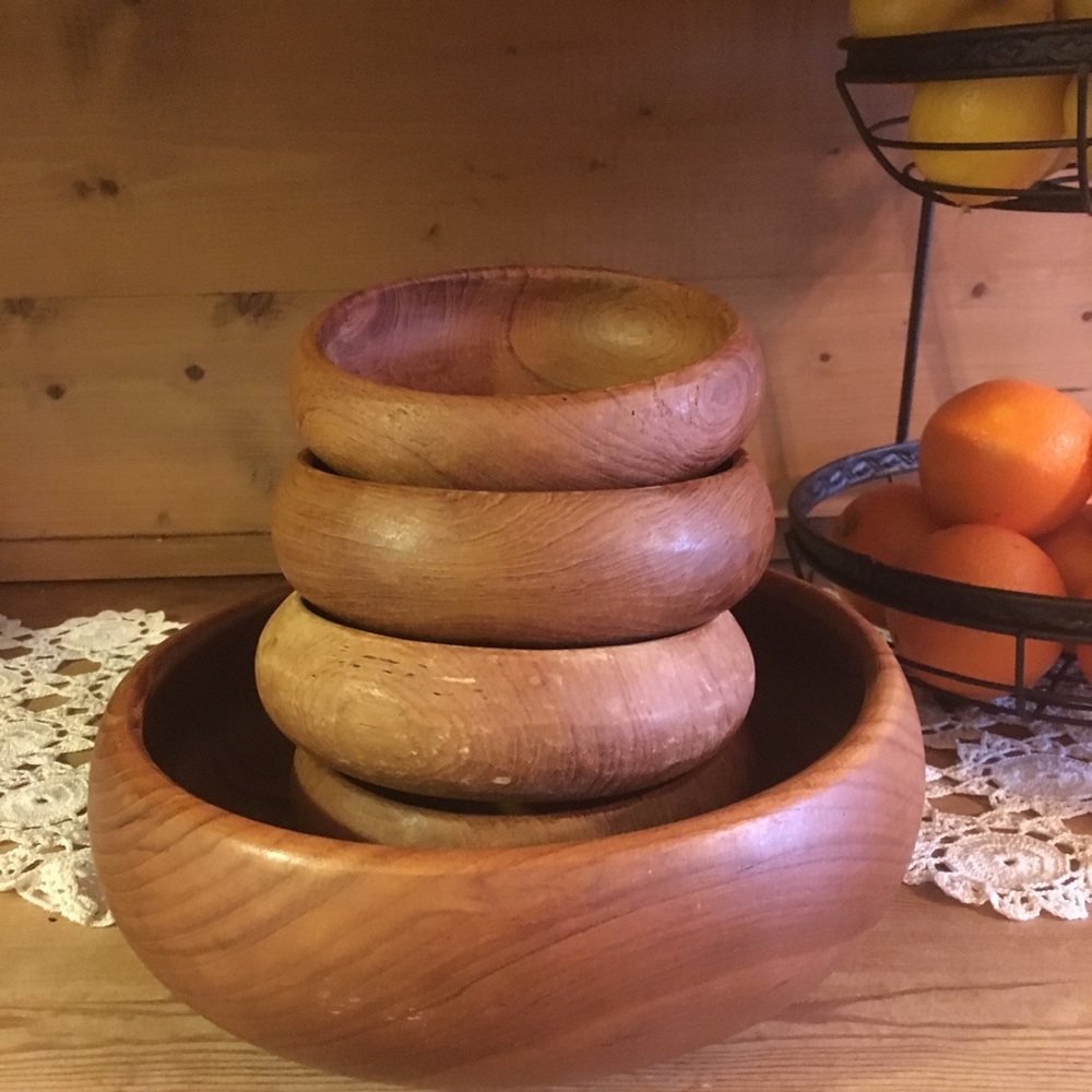 Set of four wooden bowls with large salad bowl